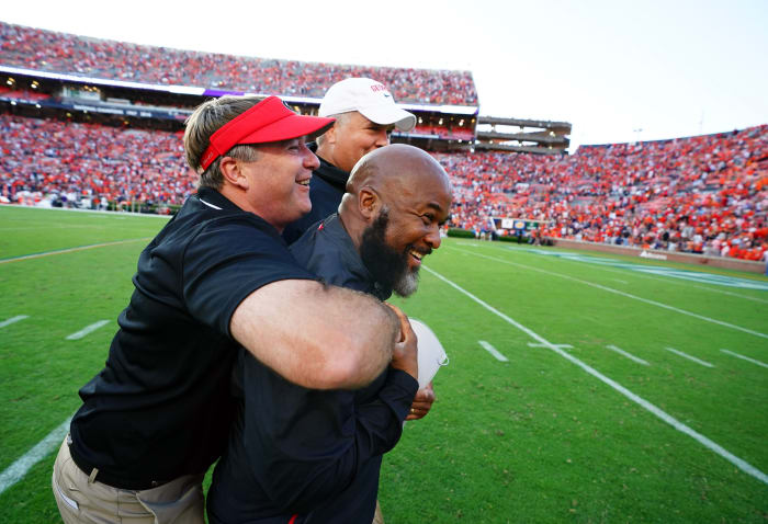 Sep 30, 2023; Auburn, Alabama, USA; Georgia Bulldogs head coach Kirby Smart celebrates with his coaches following the Bulldogs 27-20 victory at Jordan-Hare Stadium.